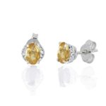 Earrings in 18 kt white gold, with diamonds and central precious stone - OD531/